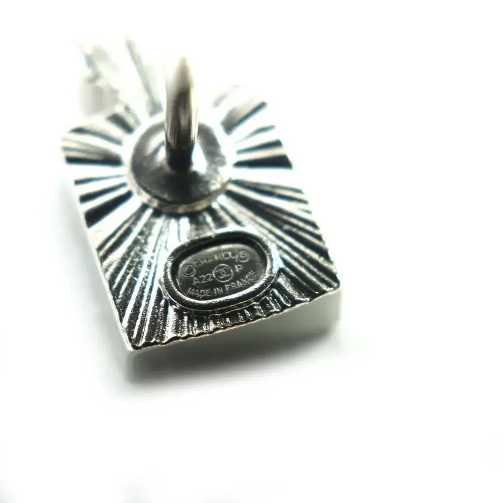 CHANEL Authentic Silver Logo Brooch